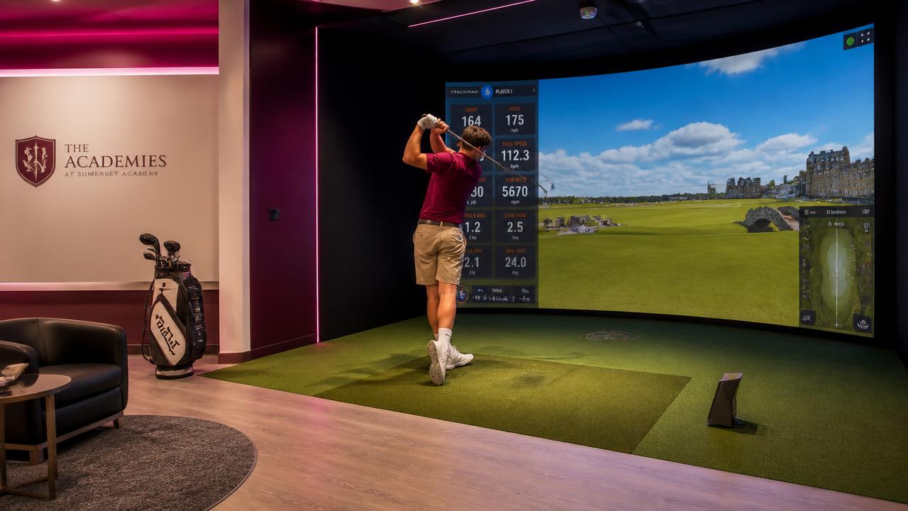 Student using a golf simulator in a school sports facility
